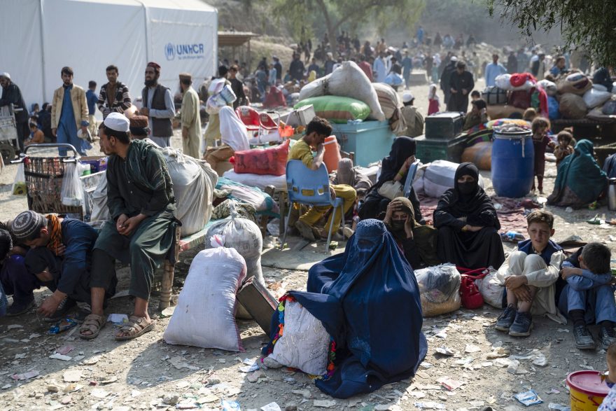 Afghan refugees sit at registration center for migrants on their arrival from Pakistan at the Afghanistan-Pakistan Torkham border in Nangarhar provinc